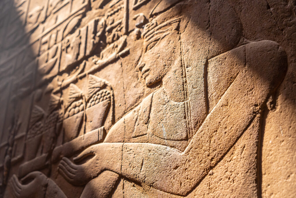 closeup of the engravings on the walls of the luxor temple egypt